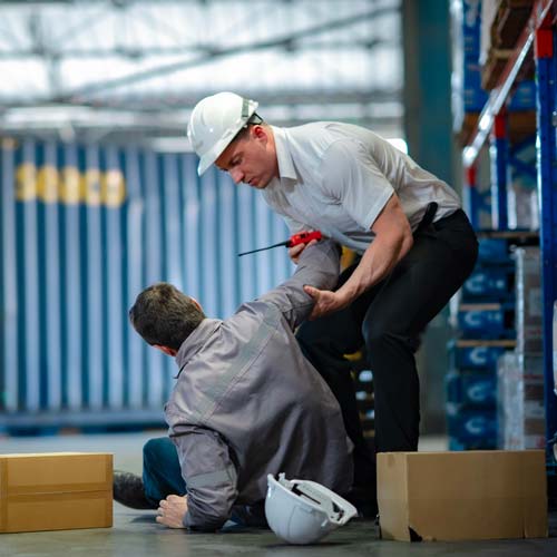 Worker fallen over in a warehouse gets help